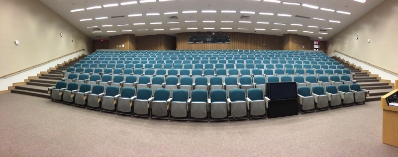 Auditorium with many empty rows of seats